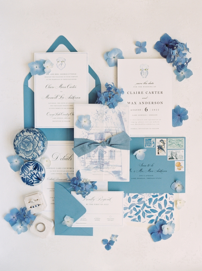 Blue and white wedding invitation flat lay