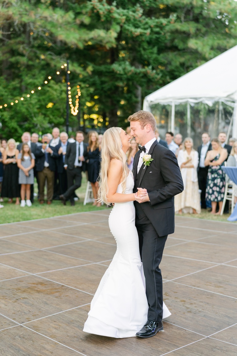 Bride and groom dancing at a backyard wedding