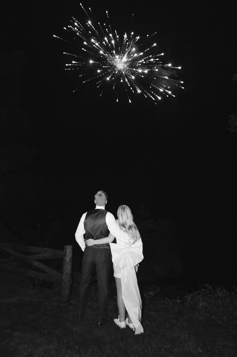 Bride and groom watching fireworks
