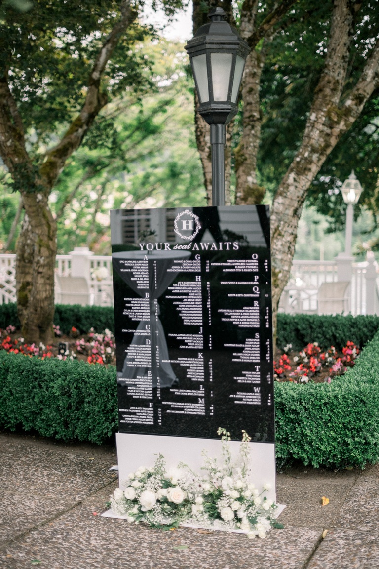 Black acrylic wedding seating chart sign by Letters and Dust