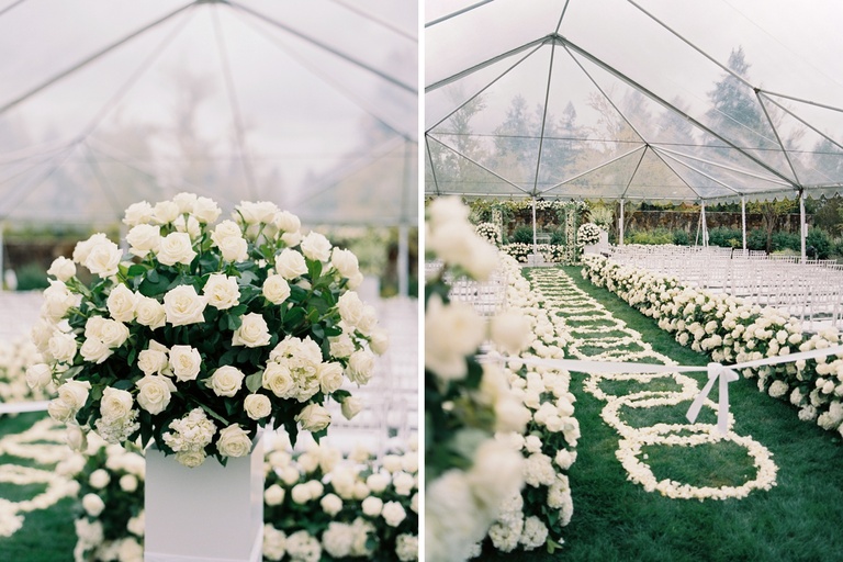 Wedding ceremony aisle decorated with rings of white flower petals